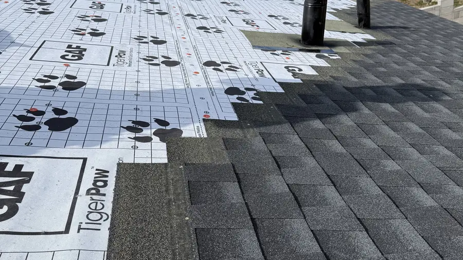 Synthetic underlayment and new architectural shingles going down during a Denali roof replacement
